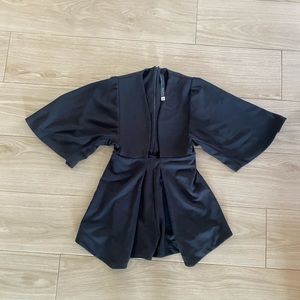 Black romper in size 6